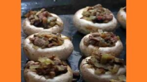 Фаршировані капелюшки печериць у духовці Фаршировані капелюшки печериць у духовці. Фото